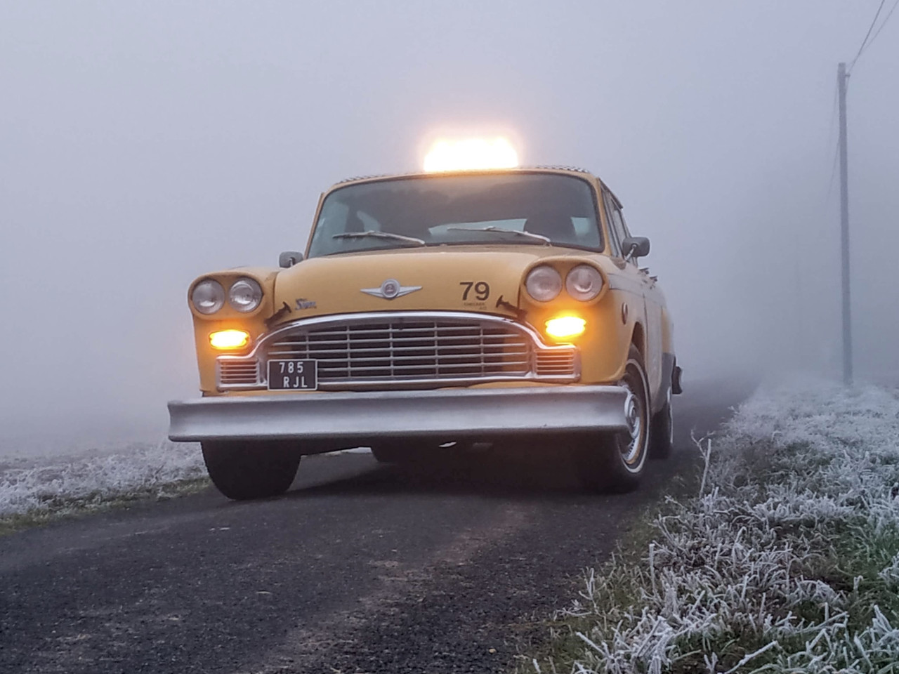 yellow cab new york taxi checker marathon in the winter fog 